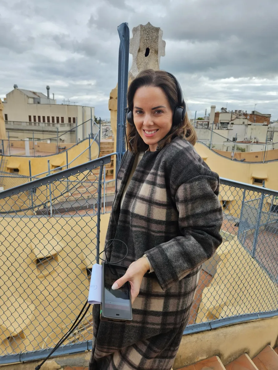 Heather with an audio guide on the rooftop of La Pedrera
