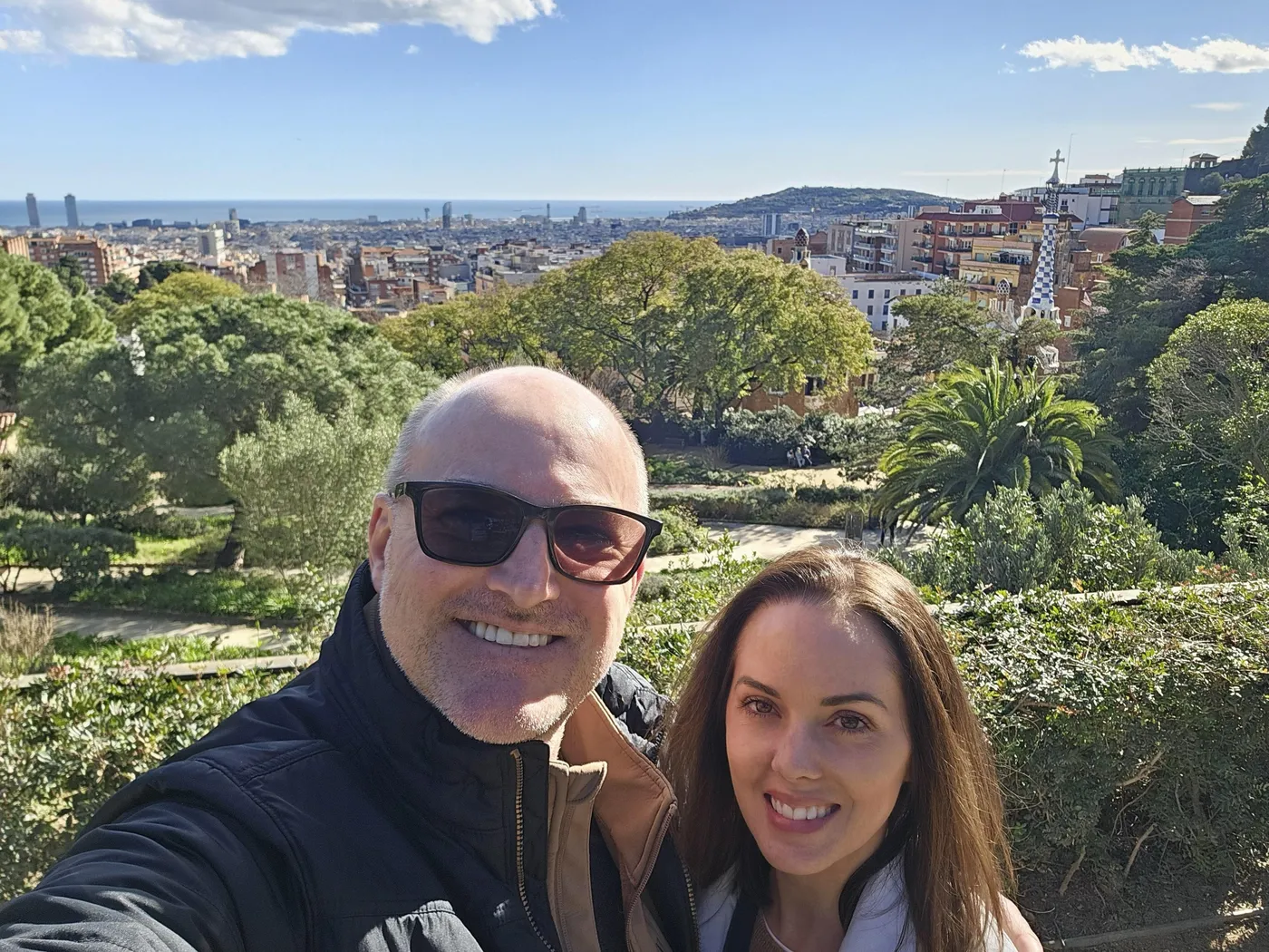 Jason and Heather at Park Güell with Barcelona and the Mediterranean behind them