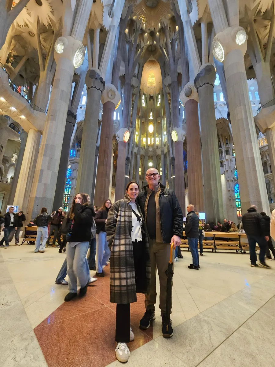 Jason and Heather inside the Sagrada Família beneath its tree-like columns