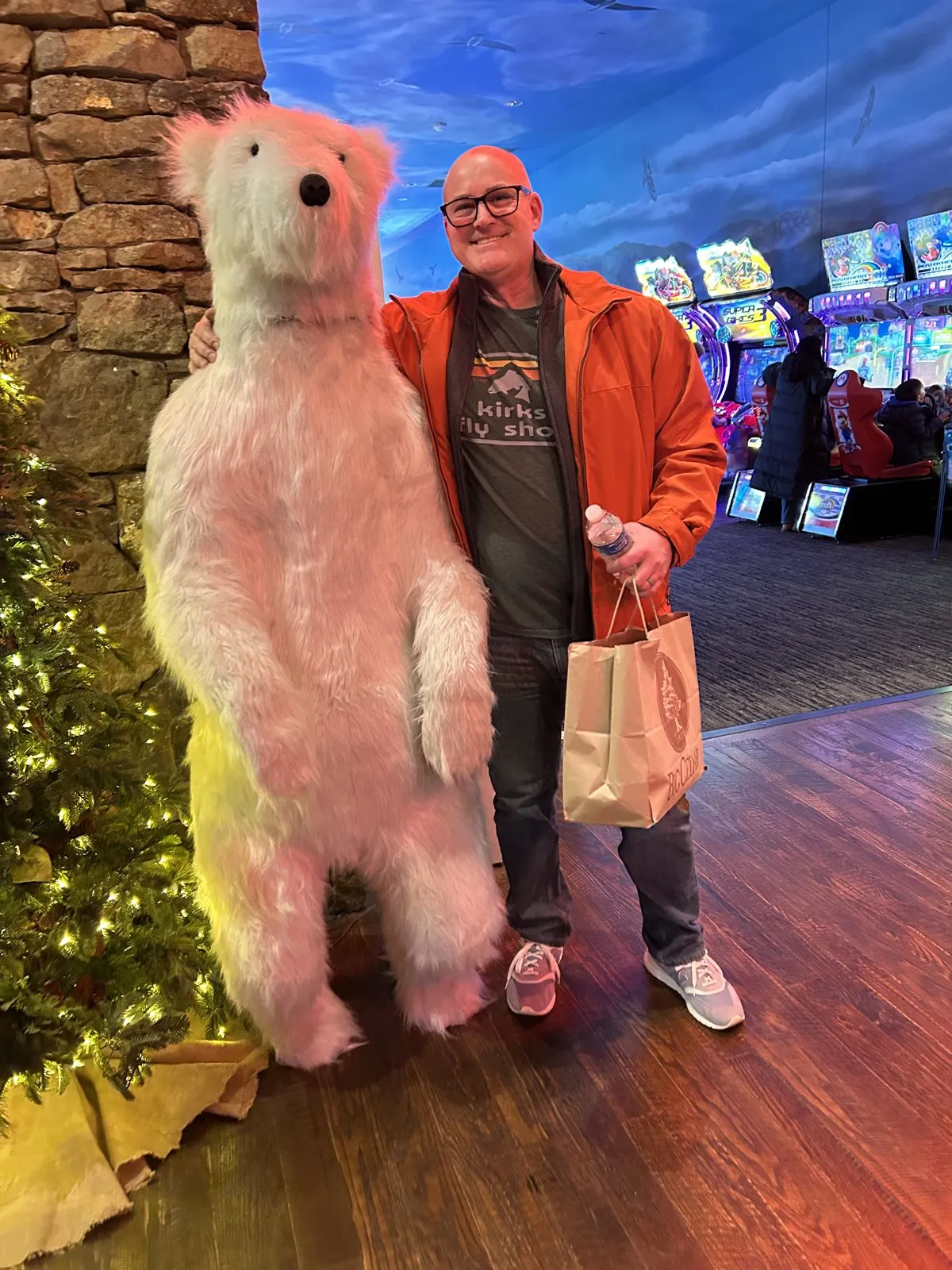 Standing next to a giant polar bear figure at Fun Mountain