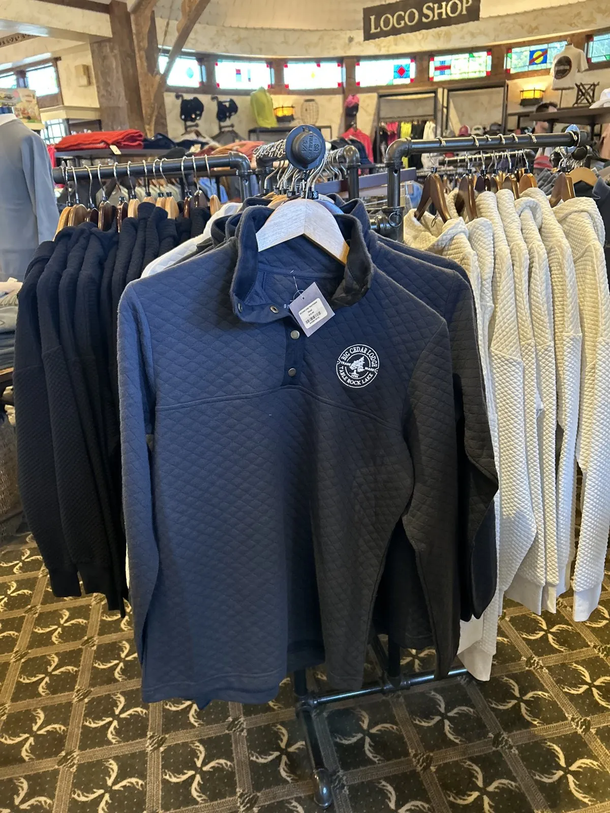 A rack of quarter-zip pullovers in the Big Cedar Lodge gift shop