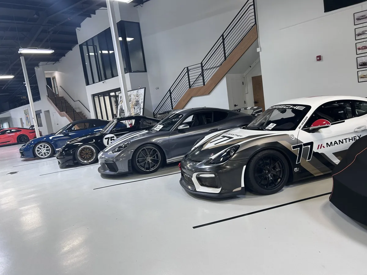 A row of Porsche GT cars including a Manthey-liveried GT4