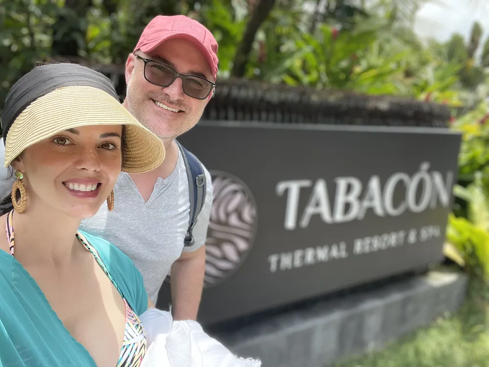 Jason and Heather at the Tabacón Thermal Resort & Spa sign in Costa Rica