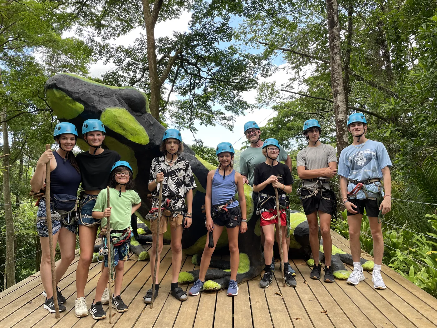 Family in helmets and harnesses before a canopy zipline tour