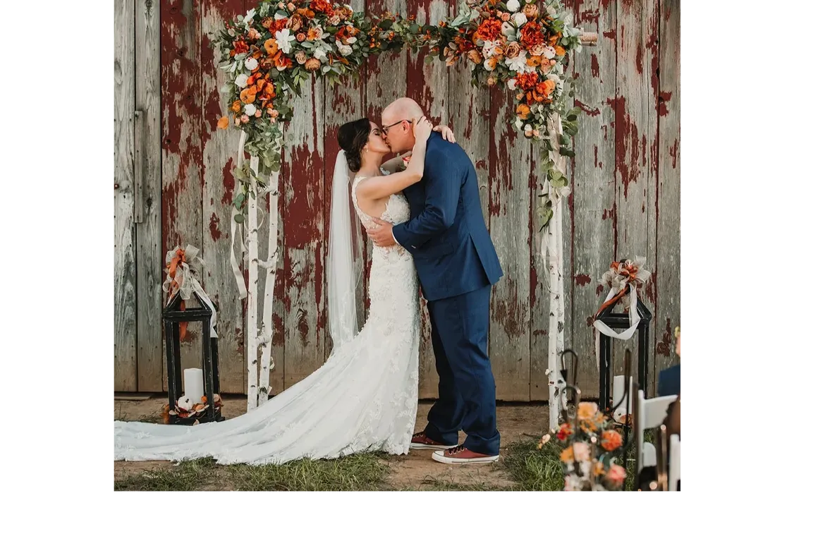 Jason and Heather's first kiss at their DIY fall wedding