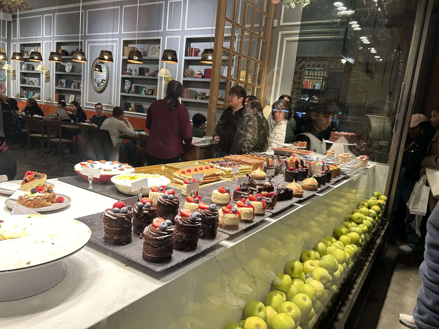 Window display of cakes and pastries at a London patisserie