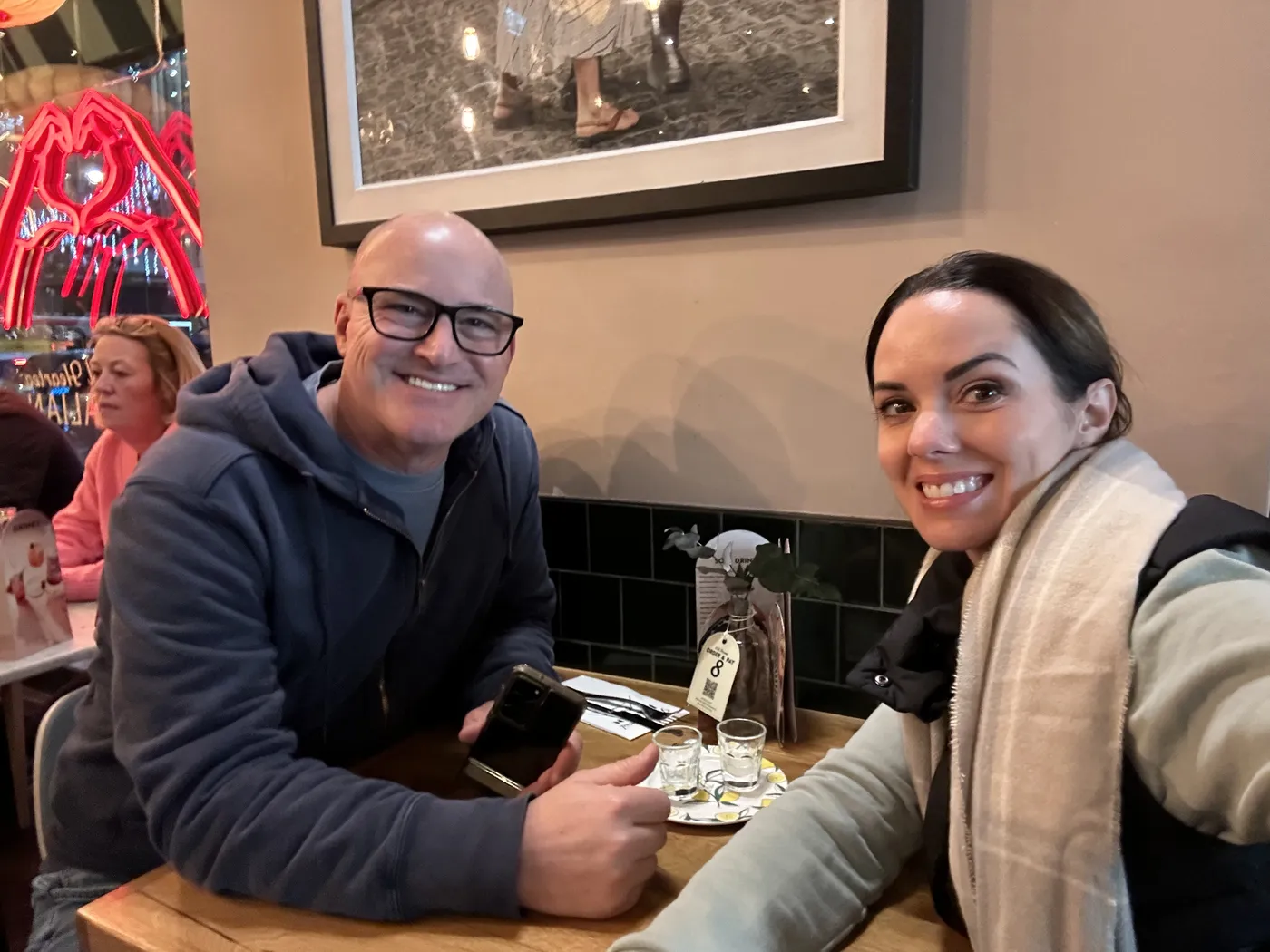 Jason and Heather at a table in a cozy London pub