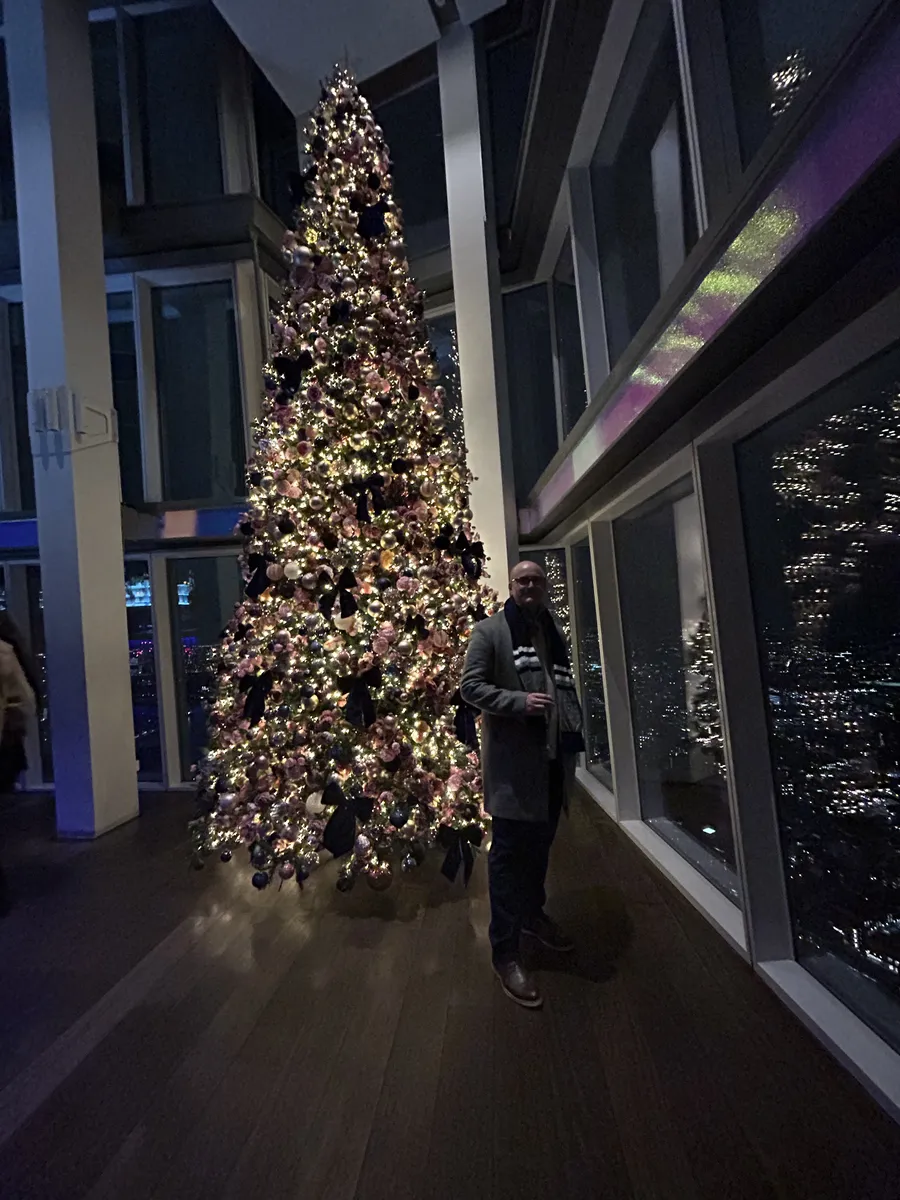 Tall Christmas tree inside the viewing gallery at the Shard